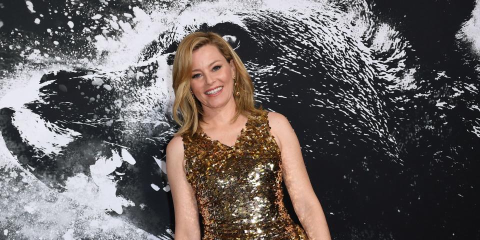 Elizabeth Banks in a gold dress