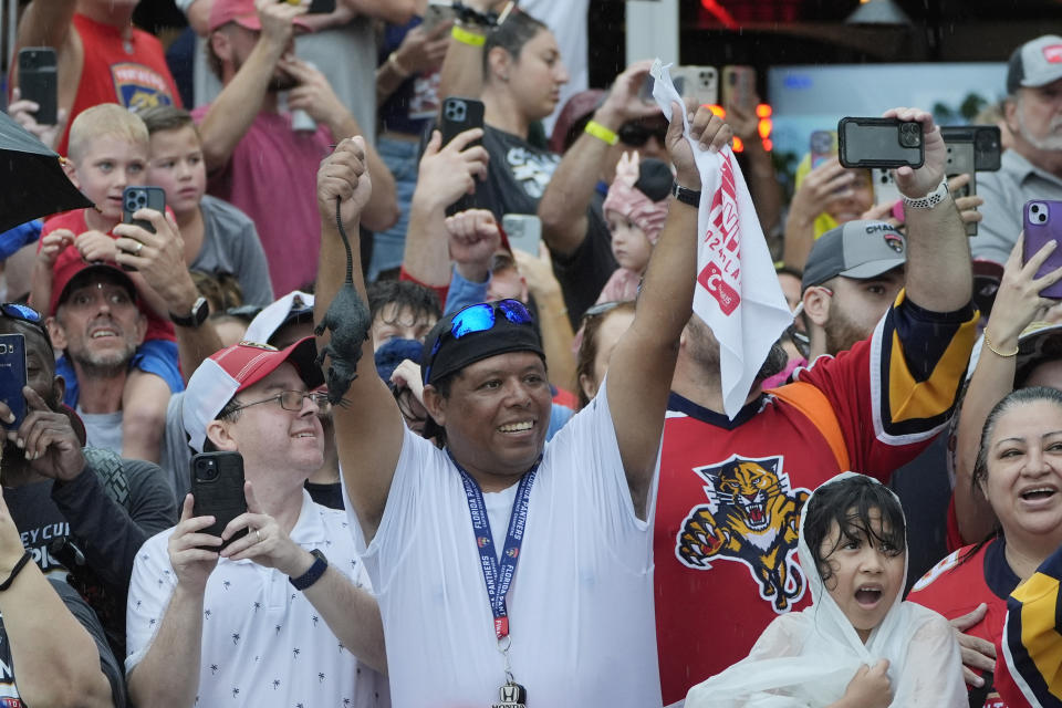 Fans cheer the Florida Panthers hockey team during an NHL hockey parade and rally, Sunday, June 30, 2024, in Fort Lauderdale, Fla. The Panthers defeated the Edmonton Oilers to win the Stanley Cup. (AP Photo/Marta Lavandier)