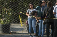 <p>A Trader Joe’s employee weeps after hearing news that a woman was shot and killed inside the store in the Silverlake section of L.A. on Saturday. (Photo: Christian Monterosa via AP) </p>