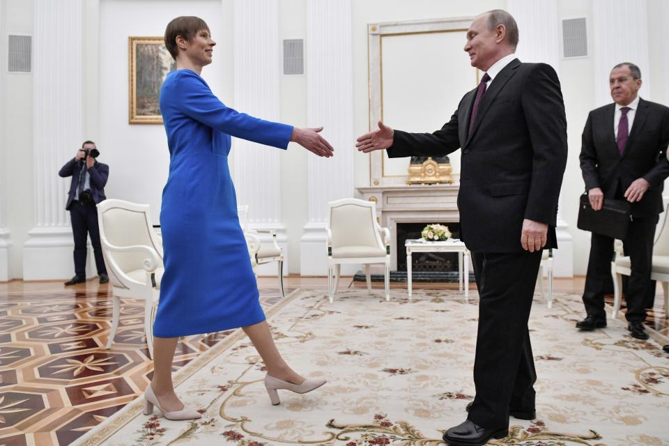 Russian President Vladimir Putin, right, greets Estonia's President Kersti Kaljulaid at the Kremlin in Moscow, Russia, Thursday, April 18, 2019. (Alexander Nemenov/Pool Photo via AP)
