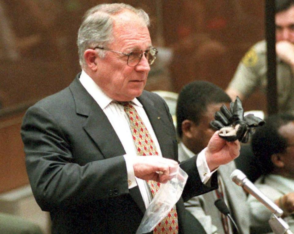 The attorney holds up the infamous black glove in 1995 (AFP/Getty)