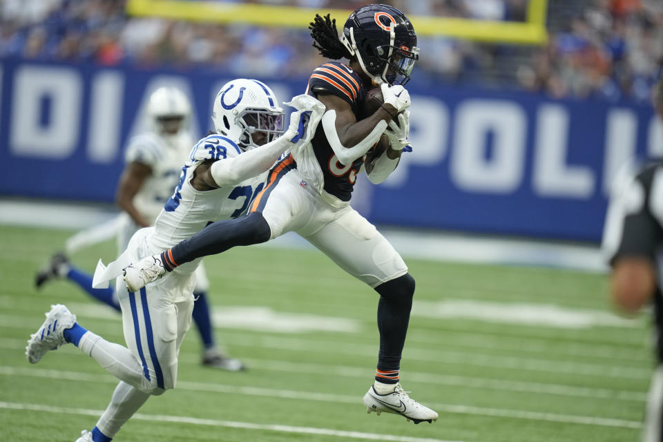Chicago Bears safety A.J. Thomas, right, pulls in a reception in front of Indianapolis Colts cornerback Tony Brown (38) during the first half of an NFL preseason football game in Indianapolis, Saturday, Aug. 19, 2023. (AP Photo/Michael Conroy)