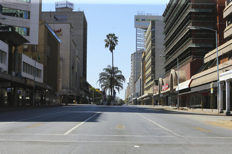 A deserted street, in Harare, Friday, July, 31, 2020. Zimbabwe's capital, Harare, was deserted Friday, as security agents vigorously enforced the country's lockdown amidst planned protests. Police and soldiers manned checkpoints and ordered people seeking to get into the city for work and other chores to return home. (AP Photo/Tsvangirayi Mukwazhi)