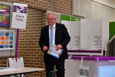 FILE PHOTO: Australian Prime Minister Scott Morrison casts his vote on Election day, at Lilli Pilli Public School, in Sydney, Saturday, 18 May, 2019. AAP Image/Mick Tsikas/via REUTERS