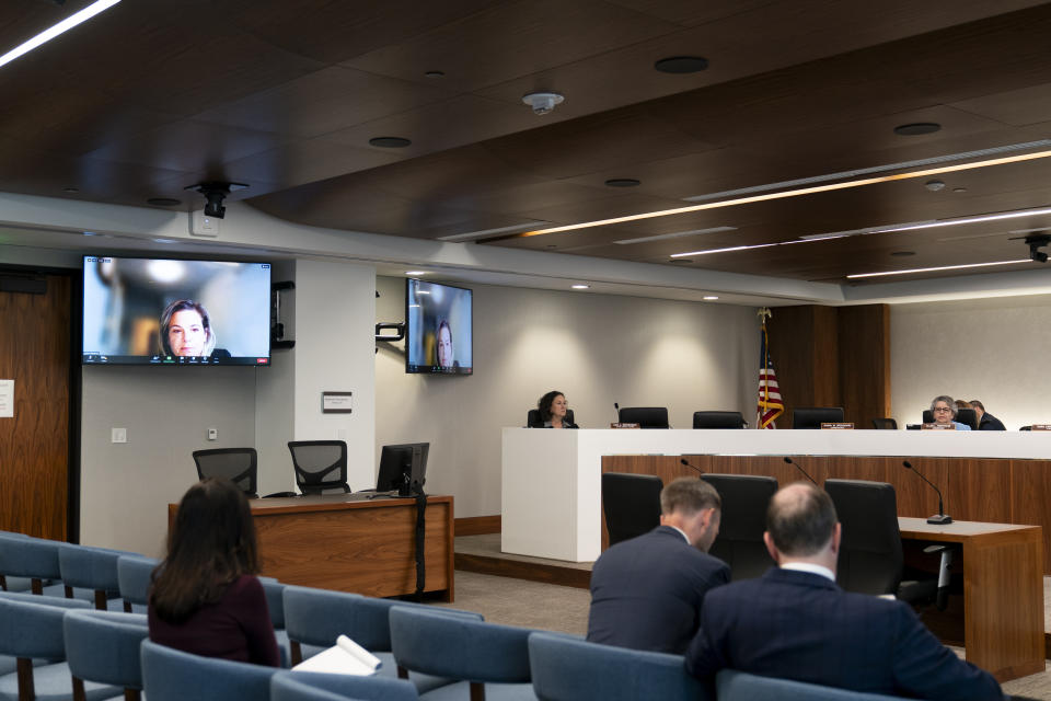 Attorney Jennifer Waldman, appears on a screen, during a Federal Election Commission public meeting on whether it should regulate the use of AI-generated political campaign advertisements, Thursday, Aug. 10, 2023, in Washington. (AP Photo/Stephanie Scarbrough)