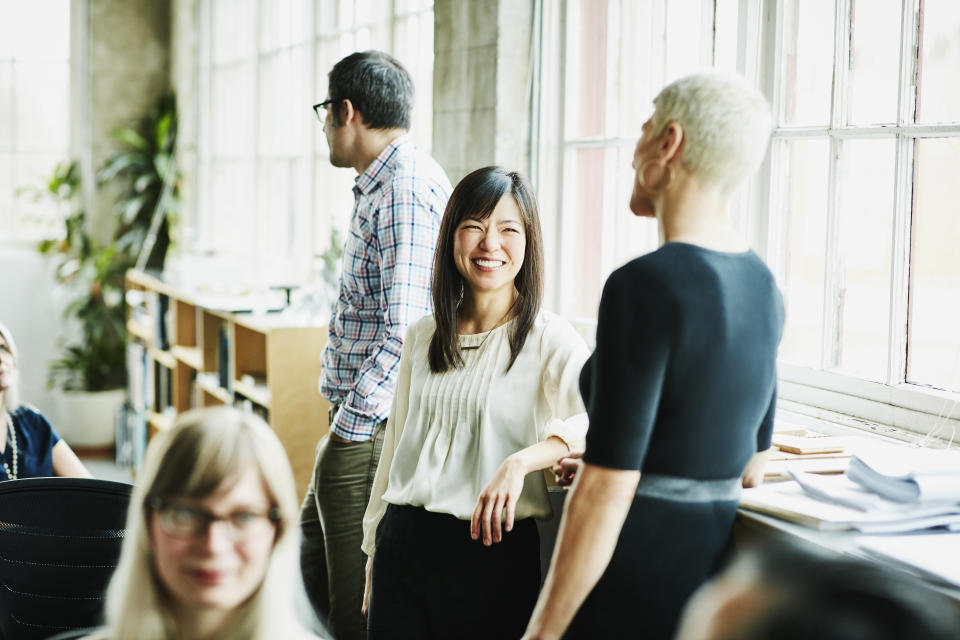 Instead of making small talk with the whole room, focus on interacting with just a few people you want to make a connection with, experts say. (Photo: Thomas Barwick via Getty Images)