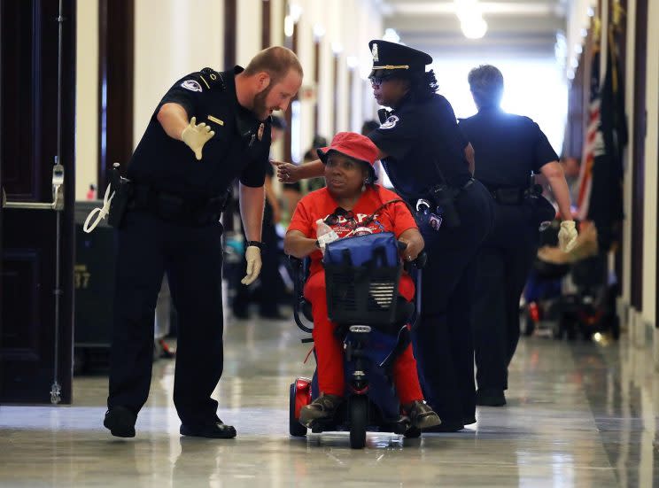 U.S. Capitol Police remove protesters from in front of the office of Senate Majority Leader Mitch McConnell inside the Russell Senate Office Building on Capitol Hill. (Photo: Mark Wilson/Getty Images)