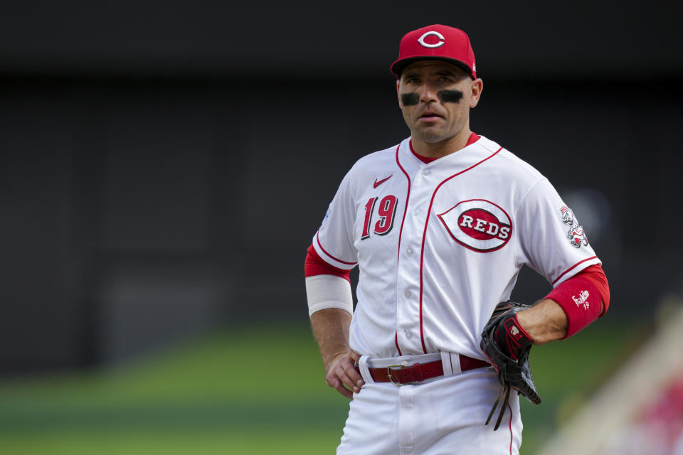 FILE - Cincinnati Reds' Joey Votto stands on the field during a baseball game against the Pittsburgh Pirates in Cincinnati, Sunday, Sept. 24, 2023. Votto's $20 million option for 2024 was declined Saturday, Nov. 4, 2023, by the Reds, making the first baseman a free agent and possibly ending his career with Cincinnati after 17 seasons. Votto will get a $7 million buyout, completing a contract that guaranteed $251.5 million over 12 seasons. (AP Photo/Aaron Doster, File)