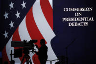 <p>A cameraman is silhouetted against an an American flag during preparations for the presidential debate at Hofstra University in Hempstead, NY, Sept. 25, 2016. (Photo: Mary Altaffer/AP)</p>