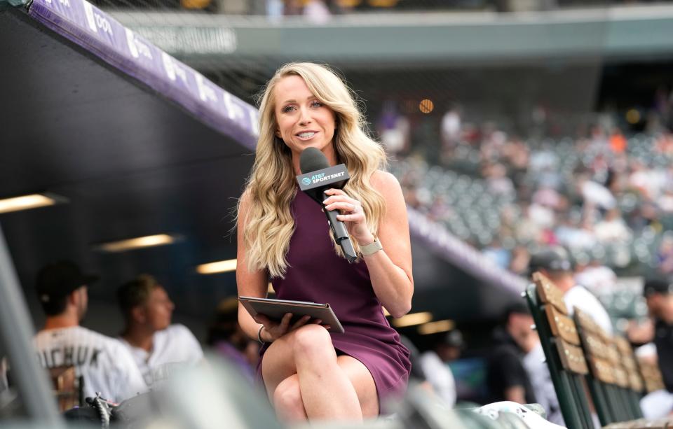 Colorado Rockies television reporter Kelsey Wingert does a spot from the first-base well before the first inning of a game against the San Francisco Giants Monday, May 16, 2022, in Denver.