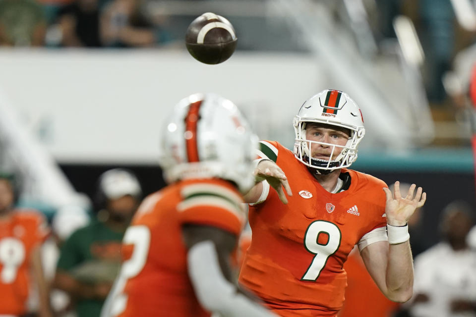 Miami quarterback Tyler Van Dyke (9) throws to wide receiver Brashard Smith during the first half of an NCAA college football game against Florida State, Saturday, Nov. 5, 2022, in Miami Gardens, Fla.(AP Photo/Lynne Sladky)