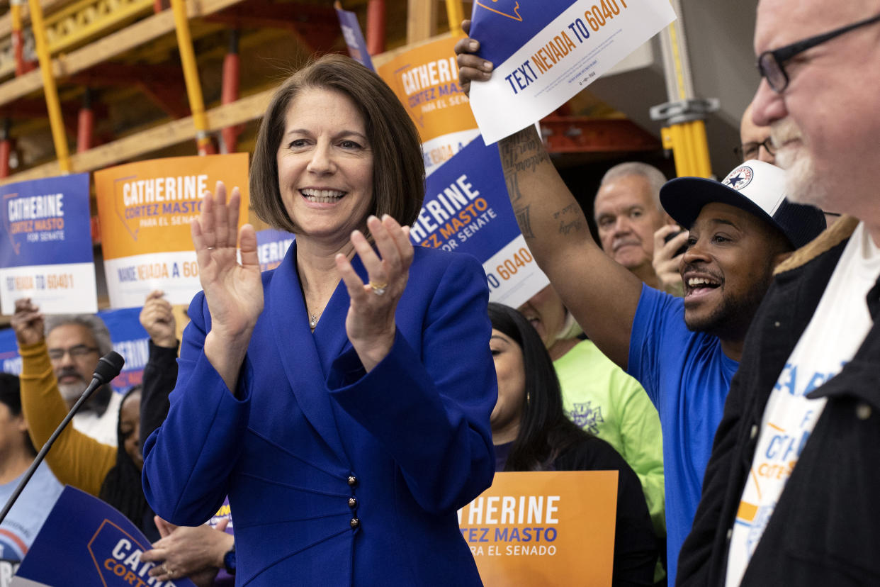 Sen. Catherine Cortez Masto, surrounded by supporters from local unions, speaks during a news conference celebrating her U.S. Senate race win, Nov. 13, 2022, in Las Vegas. (AP Photo/Ellen Schmidt)