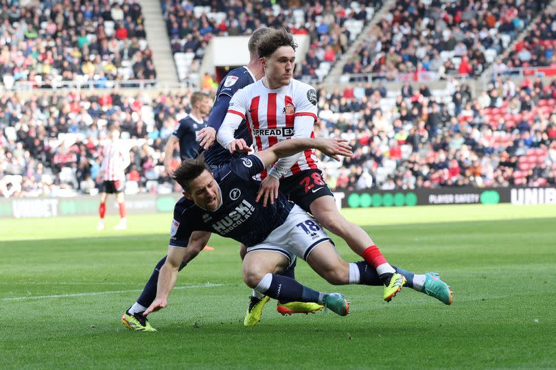 Callum styles of Sunderland is stopped by the Millwall defence