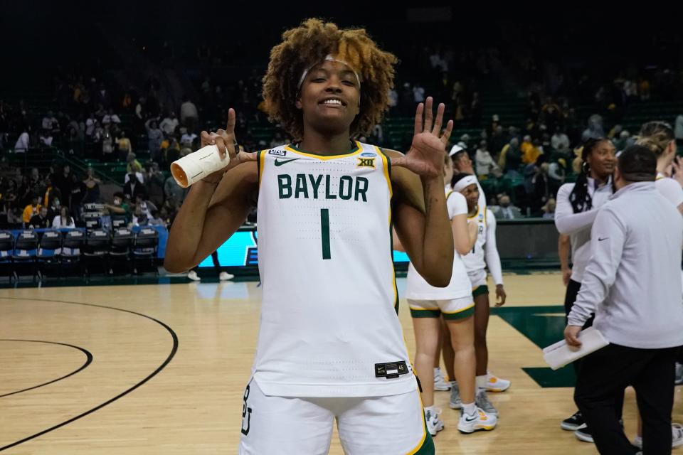 Baylor forward NaLyssa Smith celebrates a win against Hawaii.