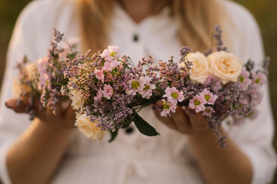 summer lifestyle portrait of beautiful young woman in a wreath of wild flowers wreath of wildflowers on his head romantic mood nature lover summer photo