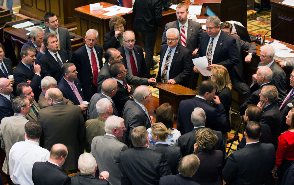 Republican lawmakers meet during a break in a House floor session in Nashville, Tenn., on Thursday, April 12, 2012. The chamber later voted to reduce the state's taxes on estates and groceries. (AP Photo/Erik Schelzig)