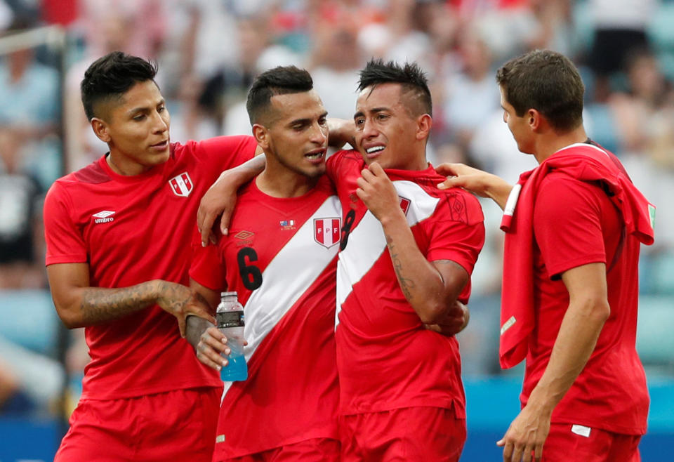 <p>Peru players may be thinking what might have been as they celebrate their first win at the World Cup </p>
