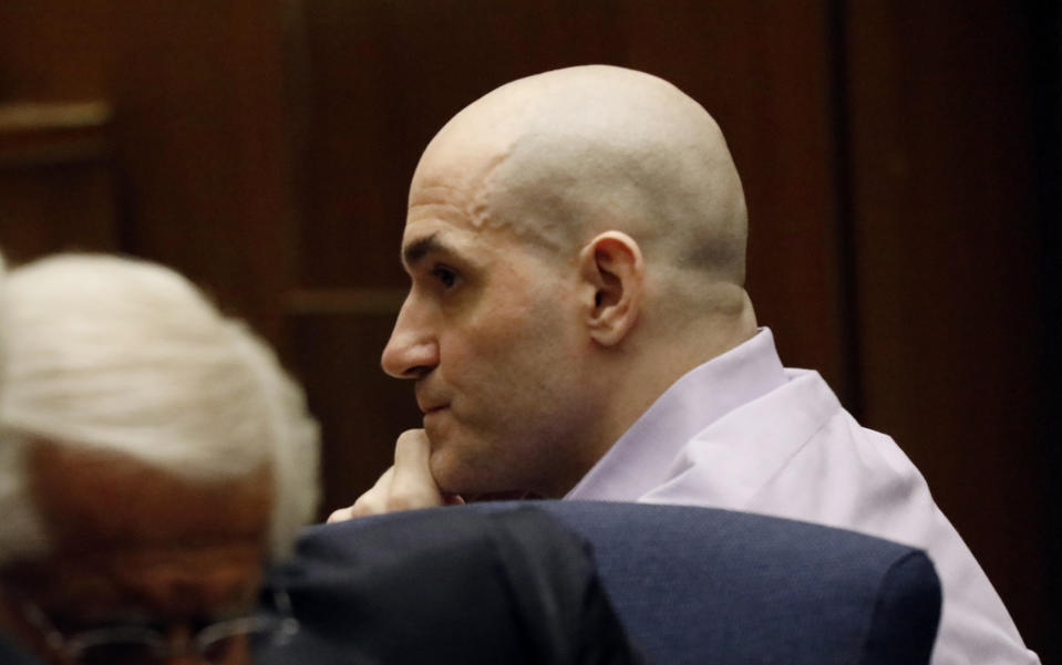 Michael Gargiulo listens as his guilty verdicts on all counts are read in Los Angeles Superior Court Thursday, Aug. 15, 2019. A jury found Gargiulo guilty of fatally stabbing two women and attempting to kill a third in their Southern California homes. Gargiulo, is also awaiting trial for a similar killing in Illinois in 1993. (Al Seib/Los Angeles Times via AP, Pool)