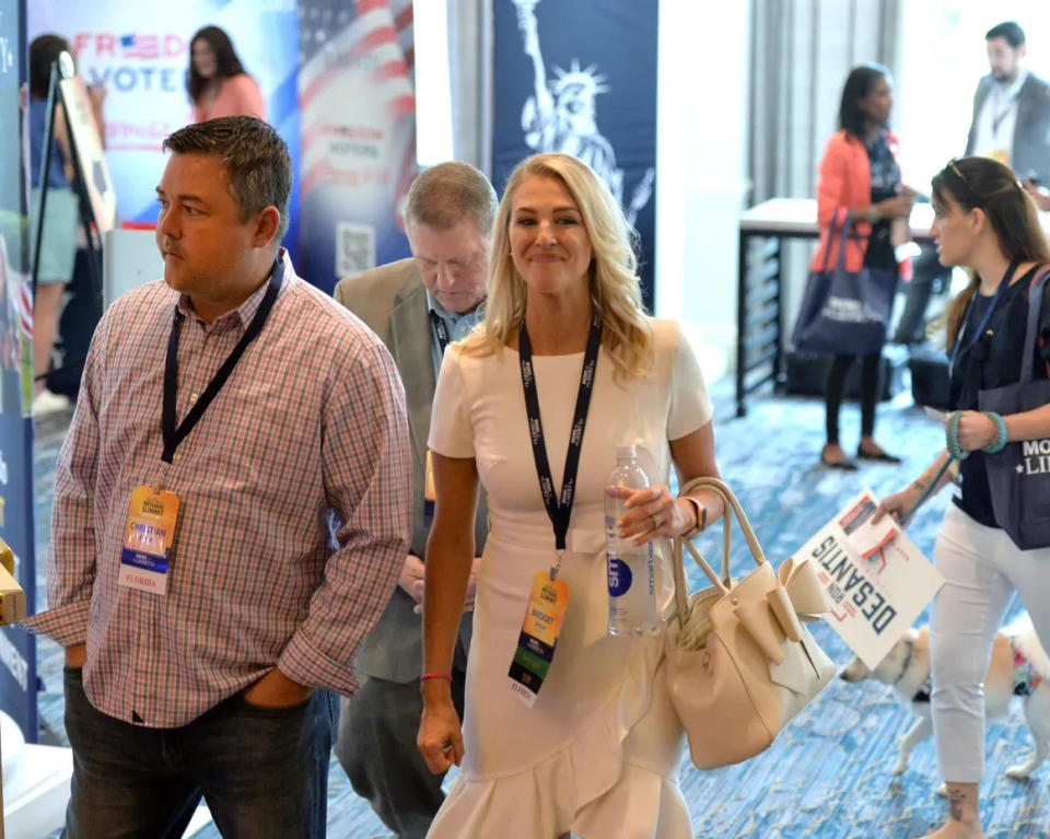 Christian Ziegler, then a Sarasota County commissioner, and his wife, Sarasota County School Board member Bridget Ziegler, arrive at the first Moms for Liberty National Summit in July 2022 in Tampa. She co-founded Moms, a right-wing activist group.
