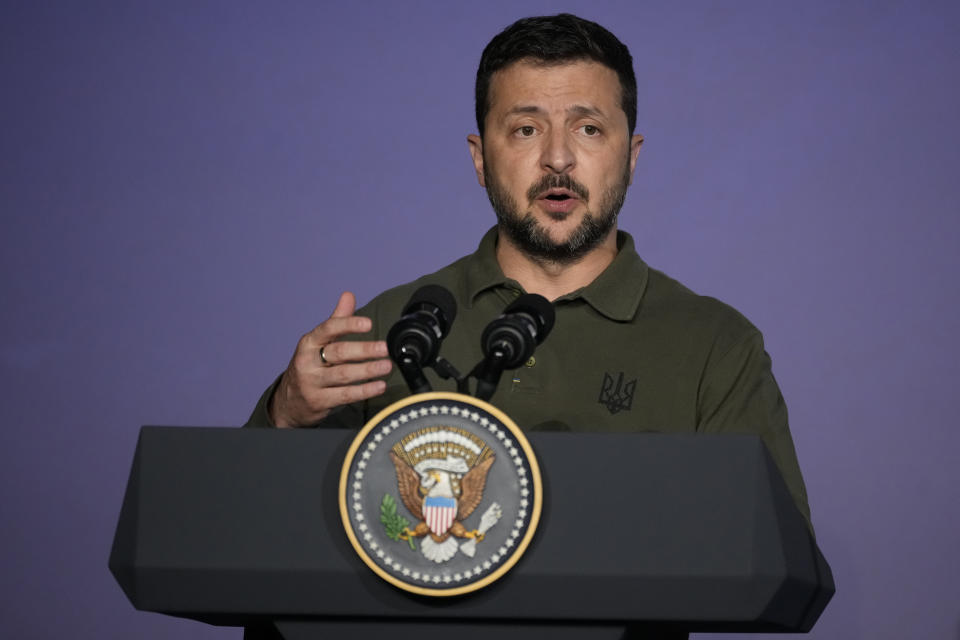 Ukraine's President Volodymyr Zelenskyy talks to journalists during a news conference after signing a bilateral security agreement with U.S. President Joe Biden during the sidelines of the G7 summit at Savelletri, Italy, Thursday, June 13, 2024. (AP Photo/Andrew Medichini)