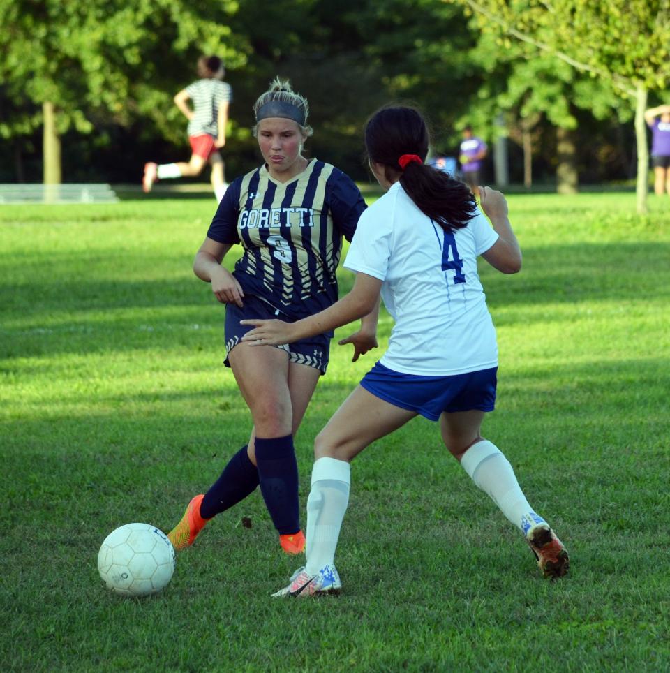 St. Maria Goretti's Peyton Miller, left, tries to get by McConnellsburg's Serenity Rengifo (4) at Fairgrounds Park in Hagerstown on Sept. 13, 2022. Miller had two goals and an assist in the Gaels' 9-1 victory.