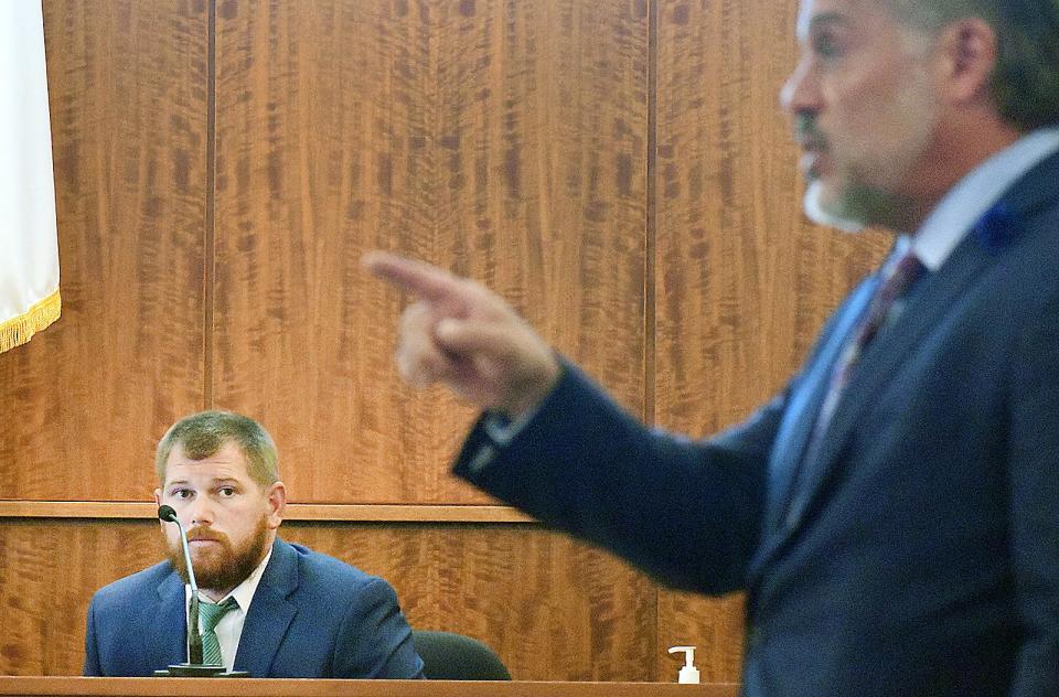 Former Fall River police officer Thomas Roberts is questioned by defense attorney Frank Camera in court Monday. Roberts was testifying in the excessive force case of Michael Pessoa.