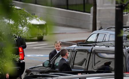 FBI Director Christopher Wray departs after a meeting with U.S. President Donald Trump on FBI investigations into Russia and the 2016 Trump presidential campaign at the White House in Washington, U.S., May 21, 2018. REUTERS/Leah Millis