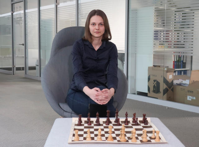 woman studying the next chess move, Stock image