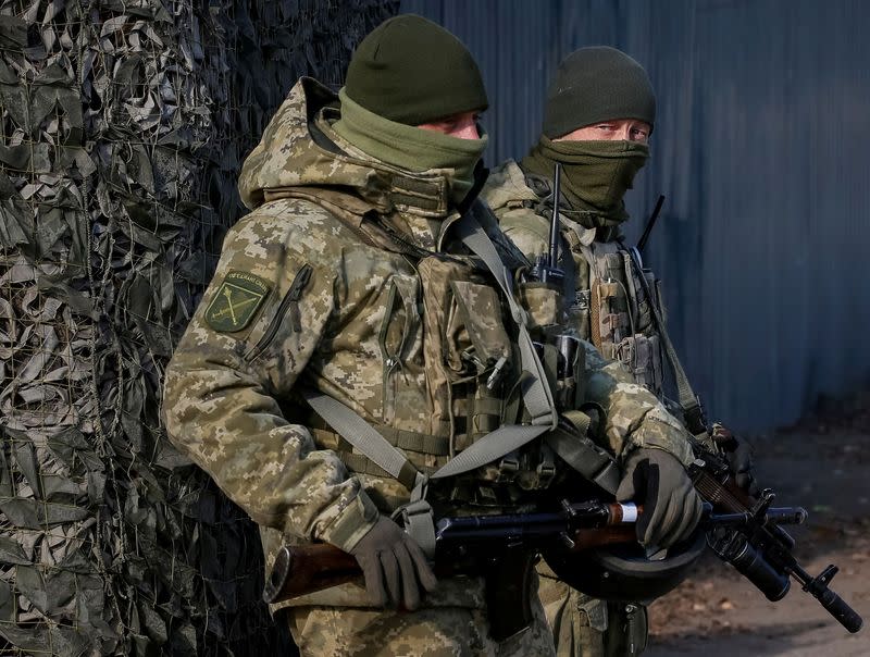 FILE PHOTO: Servicemen are seen near the village of Zolote