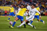 Football Soccer - Spanish Liga Santander - Las Palmas v Real Madrid - Gran Canaria stadium, Las Palmas de Gran Canaria, Spain - 24/09/16. Real Madrid's Cristiano Ronaldo and Las Palmas' Michel Macedo in action. REUTERS/Borja Suarez