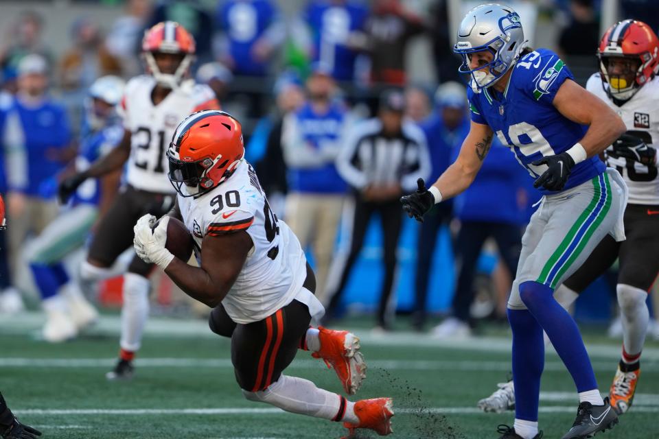 Cleveland Browns defensive tackle Maurice Hurst II (90) makes an interception against Seattle Seahawks wide receiver Jake Bobo (19) on Oct. 29, 2023, in Seattle.