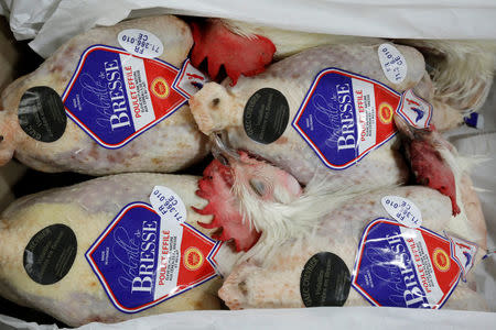 Unpacked chickens with "Made in France" labels are pictured at the poultry pavilion in the Rungis International wholesale food market as buyers prepare for the Christmas holiday season in Rungis, south of Paris, France, November 30, 2017. Picture taken November 30, 2017. REUTERS/Benoit Tessier