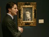 Sotheby's Emmanuel Di Donna describes Picasso's "Tete d'arlequin" at a auction house in New York, on May 3, 2007