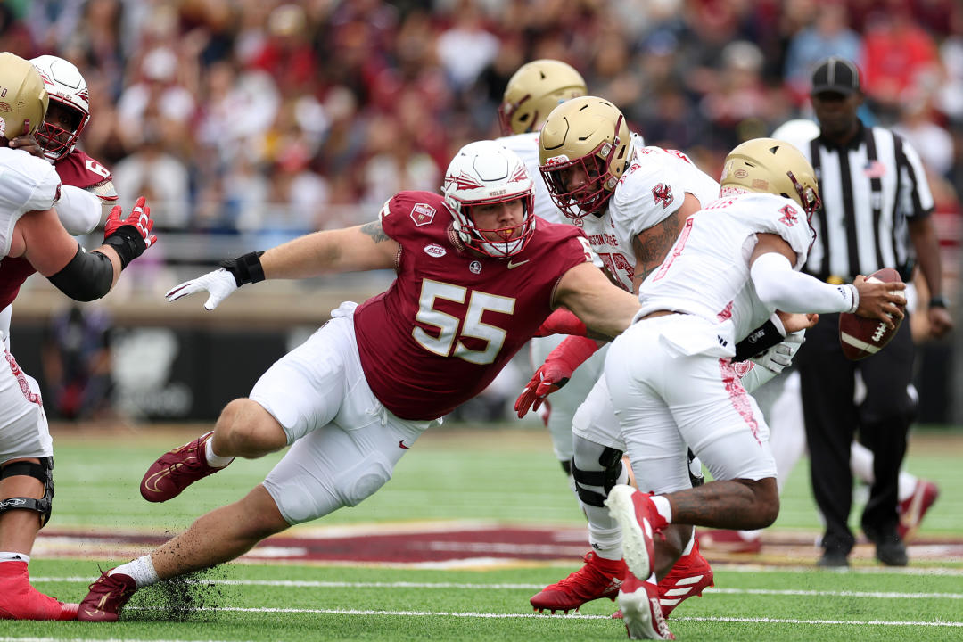 CHESTNUT HILL, MASSACHUSETTS - SEPTEMBER 16: Thomas Castellanos #1 of the Boston College Eagles evades a tackle by Braden Fiske #55 of the Florida State Seminoles during the first half at Alumni Stadium on September 16, 2023 in Chestnut Hill, Massachusetts. (Photo by Maddie Meyer/Getty Images)