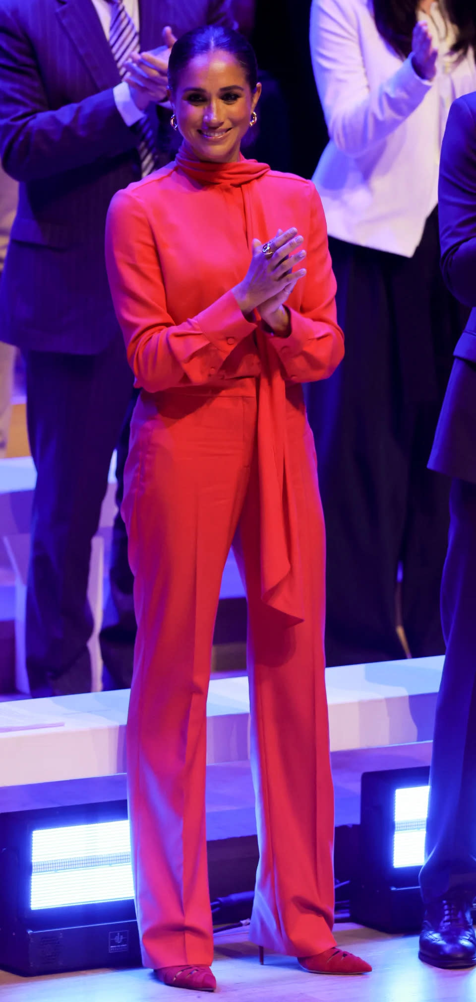 Meghan Markle chose and all-red ensemble for her first speaking engagement in the UK her and Harry stepped back as senior royals. (Getty Images)
