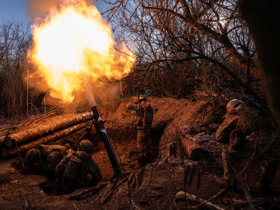 Ukrainian servicemen fire a 120 mm mortar towards Russian positions at the frontline near Bakhmut (AP)