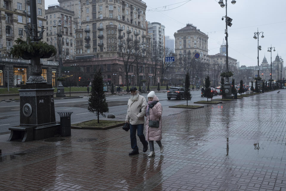 People walk on Khreschatyk street in Kyiv, Ukraine, on Friday, Jan. 26, 2024. (AP Photo/Evgeniy Maloletka)