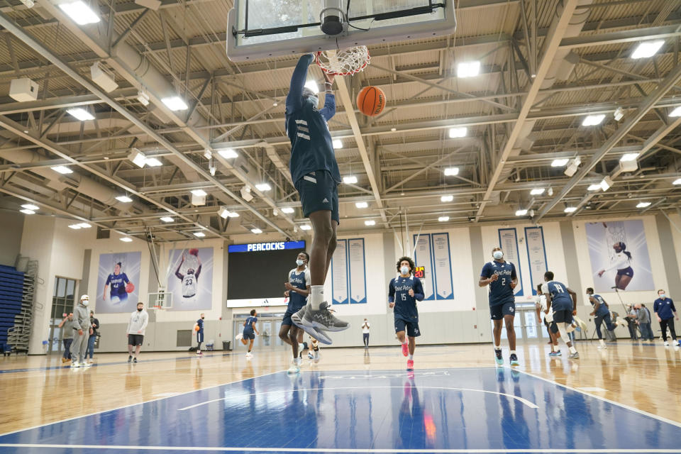 St. Peter's Clarence Rupert participates in a drill during NCAA college basketball practice in Jersey City, N.J., Tuesday, March 22, 2022. (AP Photo/Seth Wenig)