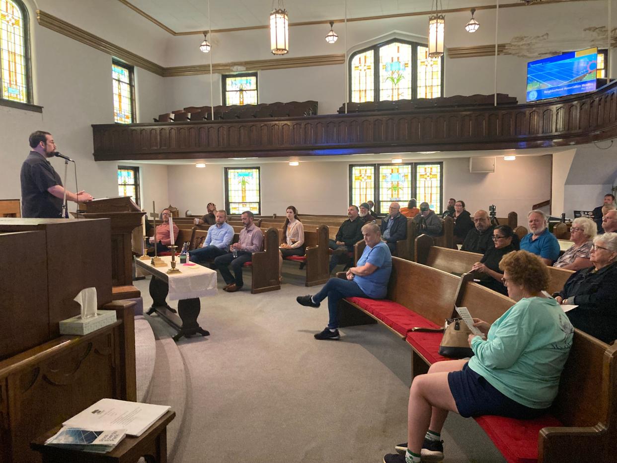 Residents from the Thomas Park-Avondale neighborhood gather at Avondale United Methodist Church Wednesday to find out more about the placement of a solar field at the contaminated vacant lot that was once the site of a longtime General Motors transmission plant.