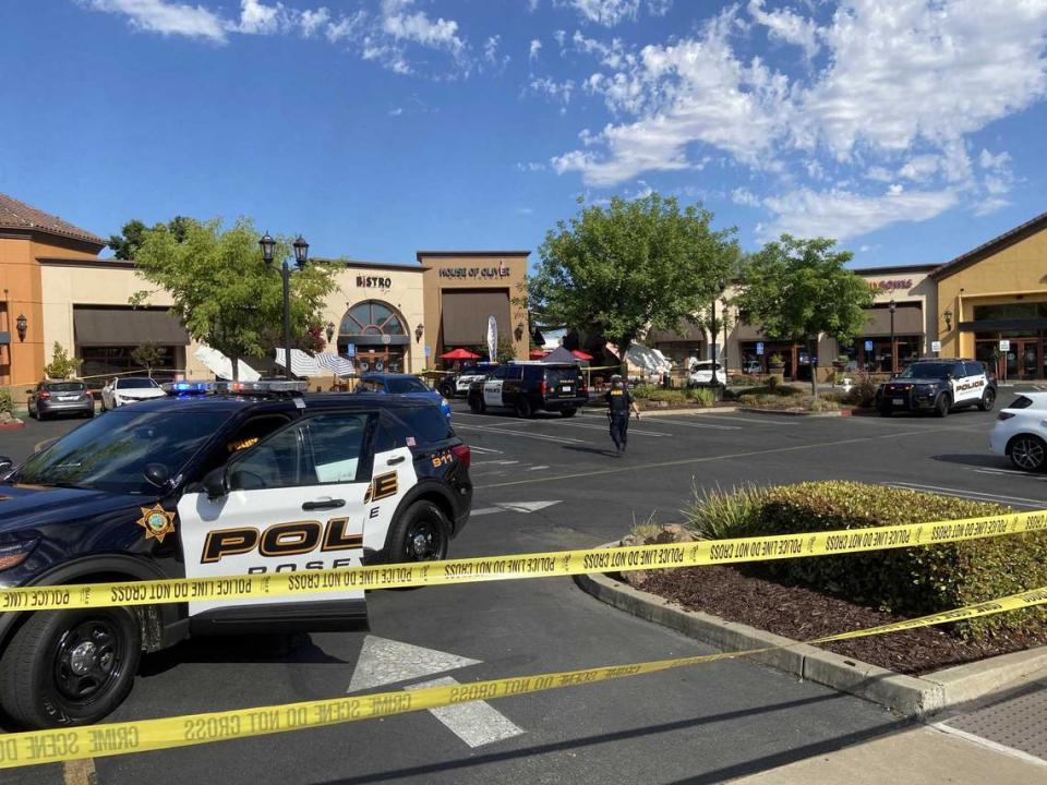 Investigators closed the parking lot outside the House of Oliver restaurant along Douglas Boulevard in Roseville, California after a shooting occurred there on Monday afternoon June 21, 2021.