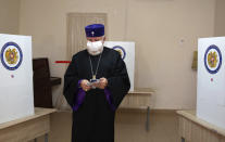 Armenian Catholicos Karekin II walks to cast his ballot at a polling station during parliamentary elections in Yerevan, Armenia, Sunday, June 20, 2021. Armenians are voting in a national election after months of tensions over last year's defeat in fighting against Azerbaijan over the separatist region of Nagorno-Karabakh. (Grigor Yepremyan/PAN Photo via AP)