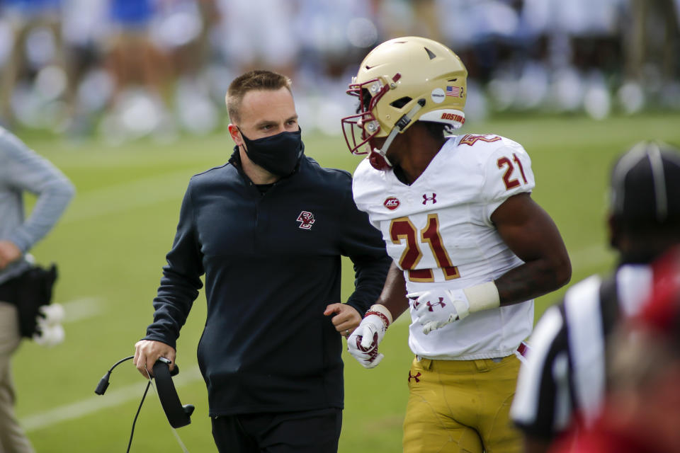 Boston College head coach Jeff Hafley, left, talks to defensive back Josh DeBerry during a game against Duke on Saturday. (Nell Redmond-Pool/Getty Images)