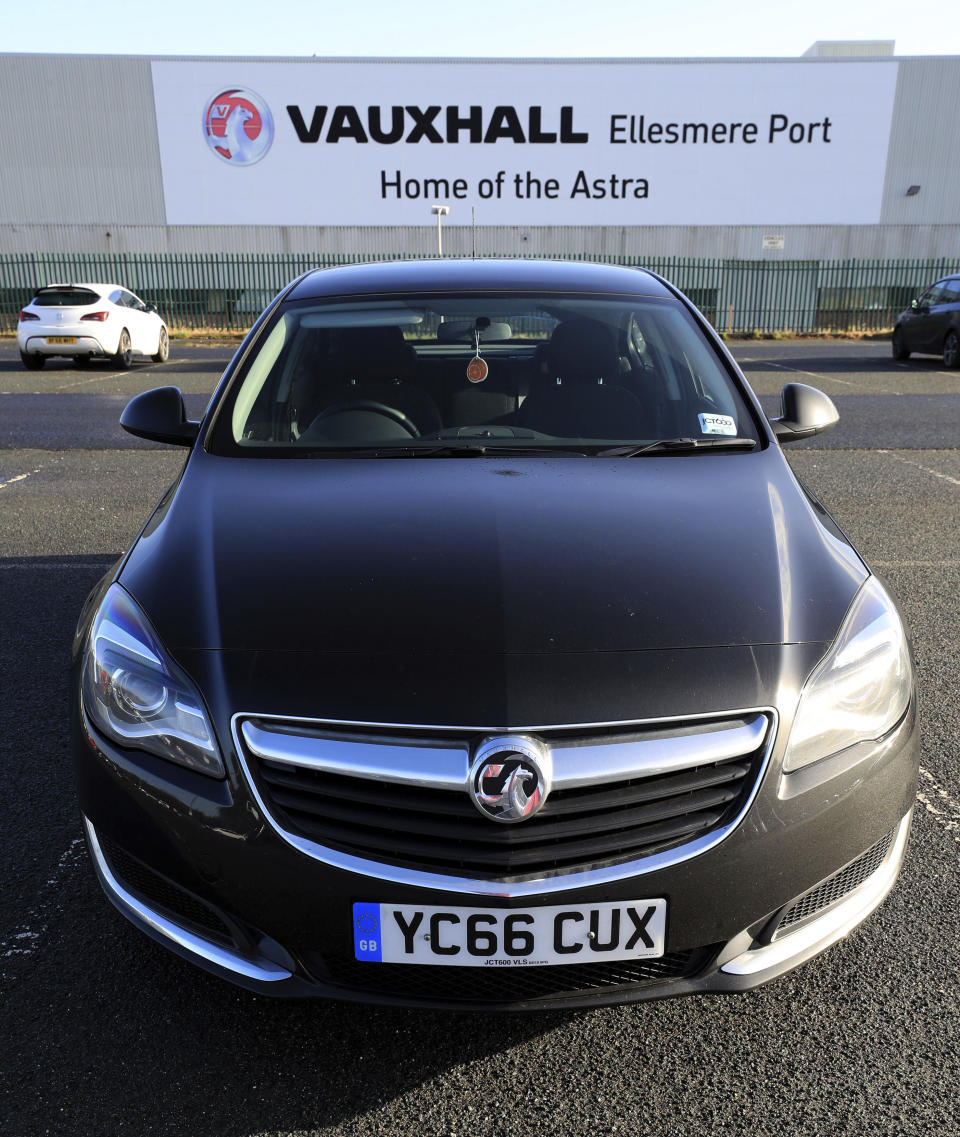 A Vauxhall Astra is parked outside the Vauxhall plant in Ellesmere Port, north-west England (Peter Byrne/PA via AP)