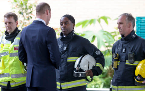 Prince William speaks to firefighters after the Grenfell Tower fire - Credit: Eddie Mulholland for The Telegraph 