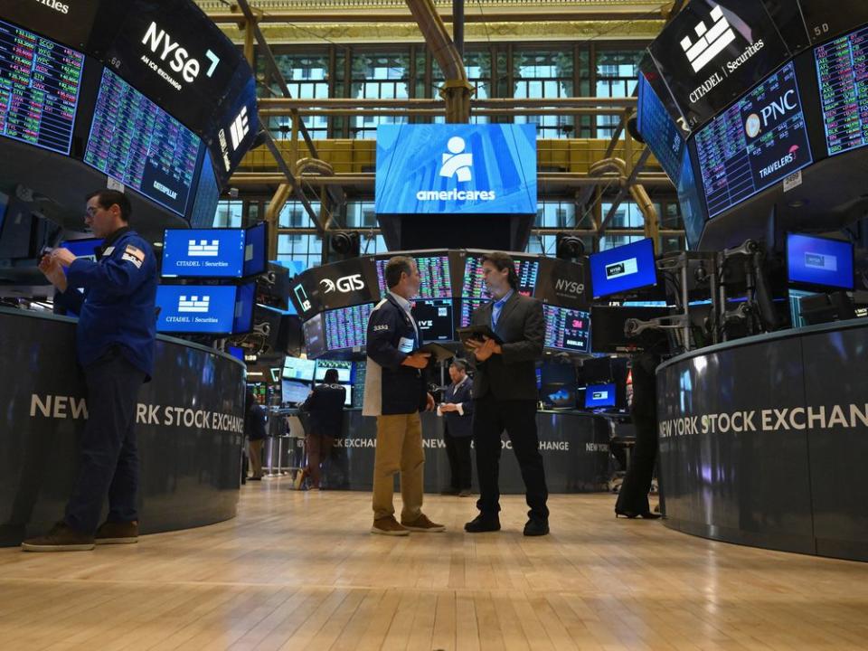  Traders on the floor of the New York Stock Exchange.