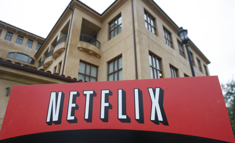 FILE - This Jan. 29, 2010, file photo shows the company logo and view of Netflix headquarters in Los Gatos, Calif. Netflix picked up nearly 16 million global subscribers during the first three months of the year, helping cement its status as one of the world's most essential services in times of isolation or crisis. (AP Photo/Marcio Jose Sanchez, File)