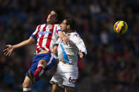 <p>Atlético Madrid’s Tiago, left, in action with Deportivo Coruña’s Jose Rodriguez during a soccer match at the Vicente Calderón Stadium in Madrid, Nov. 30, 2014. (AP Photo/Andres Kudacki) </p>