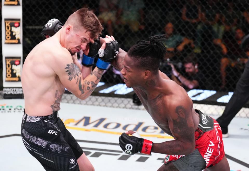 LAS VEGAS, NEVADA – OCTOBER 14: (R-L) Terrance McKinney punches Brendon Marotte in a lightweight fight during the UFC Fight Night event at UFC APEX on October 14, 2023 in Las Vegas, Nevada. (Photo by Chris Unger/Zuffa LLC via Getty Images)