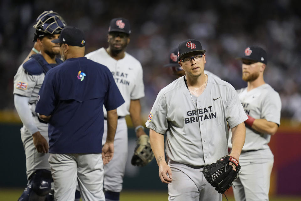 Great Britain pitcher Vance Worley, right, exits during the third inning of the team's World Baseball Classic game against the United States in Phoenix, Saturday, March 11, 2023. (AP Photo/Godofredo A. Vásquez)