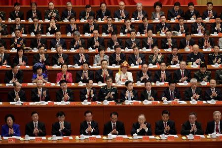 Delegates clap as Chinese President Xi Jinping delivers his speech during the opening of the 19th National Congress of the Communist Party of China at the Great Hall of the People in Beijing, China October 18, 2017. REUTERS/Jason Lee